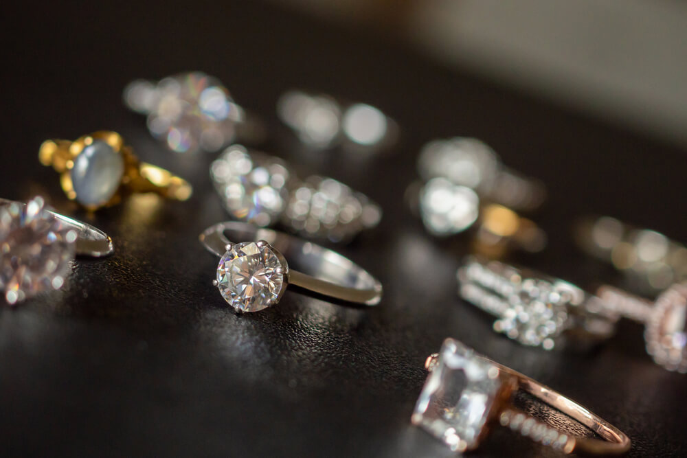 Jewelry diamond rings set on black background - Shira Diamonds