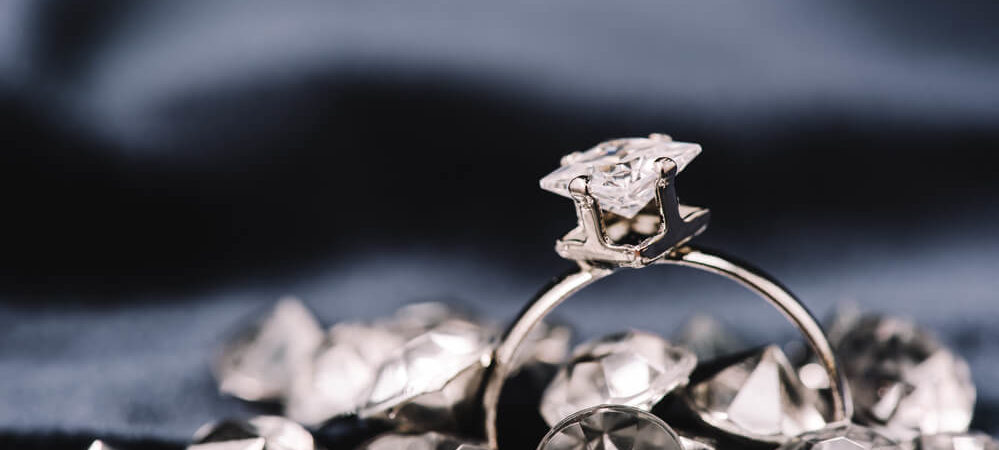 Selective focus of engagement ring with pure shiny diamonds - Shira Diamonds