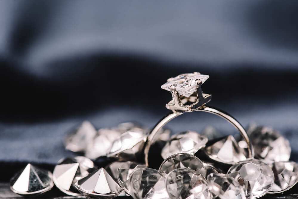 Selective focus of engagement ring with pure shiny diamonds - Shira Diamonds